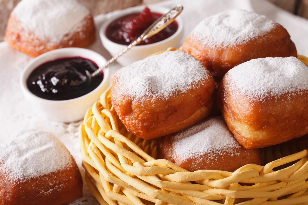 New Orleans beignets donuts in a basket on a table macro. horizontal