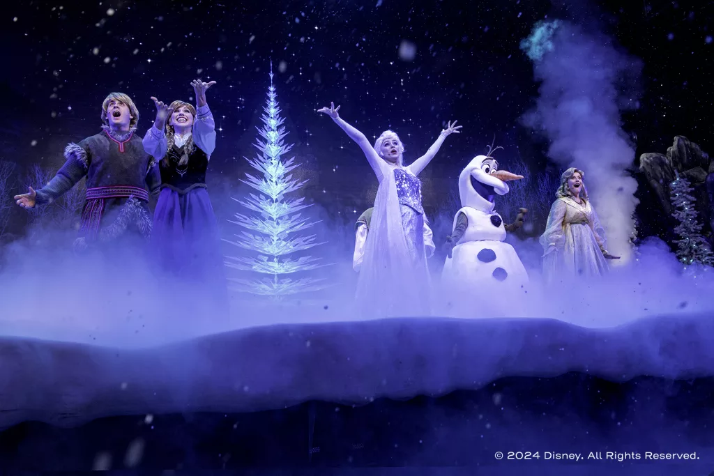 Holiday fun continues at the Hyperion Theater as Anna, Elsa and Kristoff welcome Olaf to this popular sing-along celebration. Just for the holidays, the show includes, all-new songs from Disney’s new animated short “Olaf’s Frozen Adventure.” (Kent Phillips, photographer)