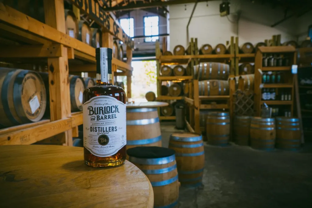 Burlock and Barrel glass bottle and barrels-medium