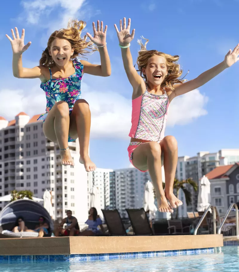 Tampa Bay Florida Girls jumping in water